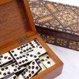 Set of bone-topped dominos and a marquetry inlaid box, largest box length 28cm