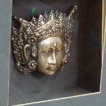 A Thai silver plated Ken Dedes ornamental mask, framed, frame height 38cm