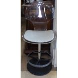 A modernist design metal and Lucite swivel chair