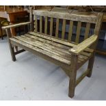 A stained teak slatted garden bench