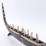 A Chinese buffalo horn and applied ivory longboat, boat length 54cm