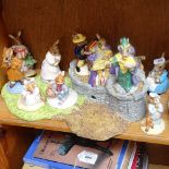 A Royal Doulton Bunnykins stand and various Bunnykins figures