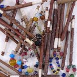A collection of turned wood lace bobbins