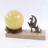 An Art Deco style table lamp, speckled marble base with brass griffon and mottled yellow shade, base