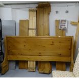 A modern polished pine 6' sleigh bed, complete with slats