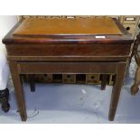 An Edwardian mahogany and leather-seated rise and fall piano stool