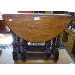 A small oak drop leaf gateleg table, W60cm