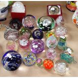 A collection of glass paperweights, including Langham and Caithness, tallest 14cm