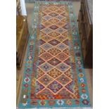 A Choli Kilim runner, 248cm x 84cm