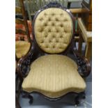 A Victorian carved and pierced mahogany-framed armchair on cabriole legs