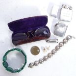 A silver coin set bracelet, Vesta, lighter, marcasite brooches etc