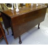 A George III mahogany drop leaf dining table, on turned legs and pad feet, W107cm