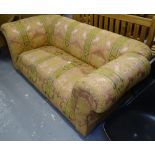 An Edwardian upholstered single drop-end settee