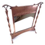 A double-sided mirrored copper-framed fire screen, height 54cm