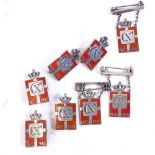 8 Georg Jensen Danish silver and red enamel Kingmark badges and brooches, height 2.5cm (8)