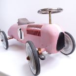 A modern red painted child's toy ride-on racing car, length 74cm