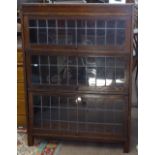 A 1920s Minty style bookcase, with 3 leadlight glazed rise and fall fronts, W87cm