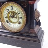 A late 20th century Ansonia Clock Co black painted cast-iron 8-day mantel clock, cream enamel dial