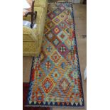 A vegetable dyed Kilim runner, 287cm x 83cm