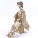 A large late 19th century Japanese carved ivory okimono, depicting seated lady in kimono, signed