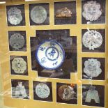 A framed set of various Oriental carved and polished jade amulets/pendants, and a blue and white