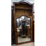 An Antique Continental walnut armoire, with single mirrored door and drawer fitted base, W105cm