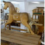 A stained pine rocking horse (A/F)