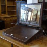 An 18th century mahogany and satinwood-banded toilet mirror, with with writing slope base, W60cm