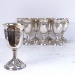 A fine quality set of 8 Continental silver goblets, with gilded bowls on foot, with applied grape