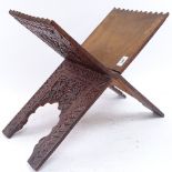 An Eastern carved hardwood Koran stand, closed length 61cm