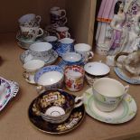 Various decorative cabinet cups and saucers
