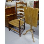 A Victorian oak ladder-back rush-seated elbow chair, and an oak rectangular top tripod table