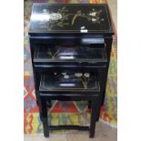 A nest of 3 Chinese design black lacquered occasional tables, with floral and bird decoration,