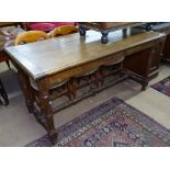 An Antique jointed oak refectory table, on turned legs with H-shaped stretcher, L154cm