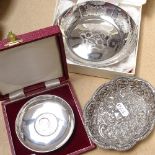A silver dish with inset Churchill coin, boxed, a small silver dish with embossed and pierced