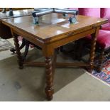 An oak draw leaf dining table on cross stretchers and barley twist legs, W91cm
