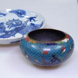 A Chinese cloisonne bowl with dragon decoration, 13.5cm across, and a Chinese porcelain dish with
