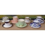 A collection of cabinet cups and saucers