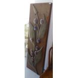 A stained wood double-sided panel with applied floral decoration, W 50cm
