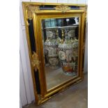 A modern gilt and ebonised bevelled-edge rectangular wall mirror, W92cm