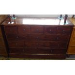 A hardwood chest of 13 drawers on plinth base, W130cm