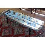 A mid-century mirrored coffee table with zodiac design top, L122cm