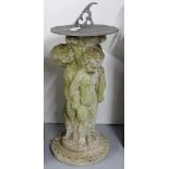 An embossed lead sundial on a concrete cherub design stand, H60cm
