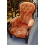 A Victorian walnut-framed button-back armchair