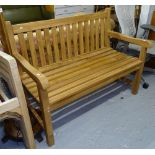 A teak slatted garden bench