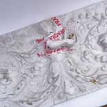 A large white painted papier mache plaque, high relief Venus and foliate decoration, length 99cm (