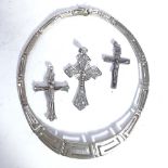 A stylised sterling silver Greek Key design necklace, and 3 .925 silver crucifixes