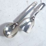 A Georg Jensen sterling silver caddy spoon with rope edge pattern, dated 1924, and a Georg Jensen