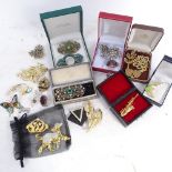 Various boxed costume brooches, paste set brooch etc