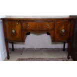An early 20th century mahogany bow-front knee-hole sideboard with drawer and cupboards, on square